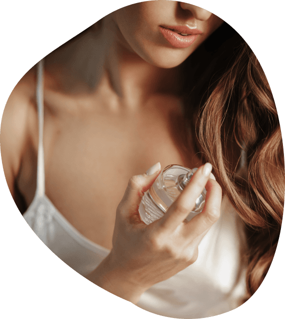 Woman smelling perfume